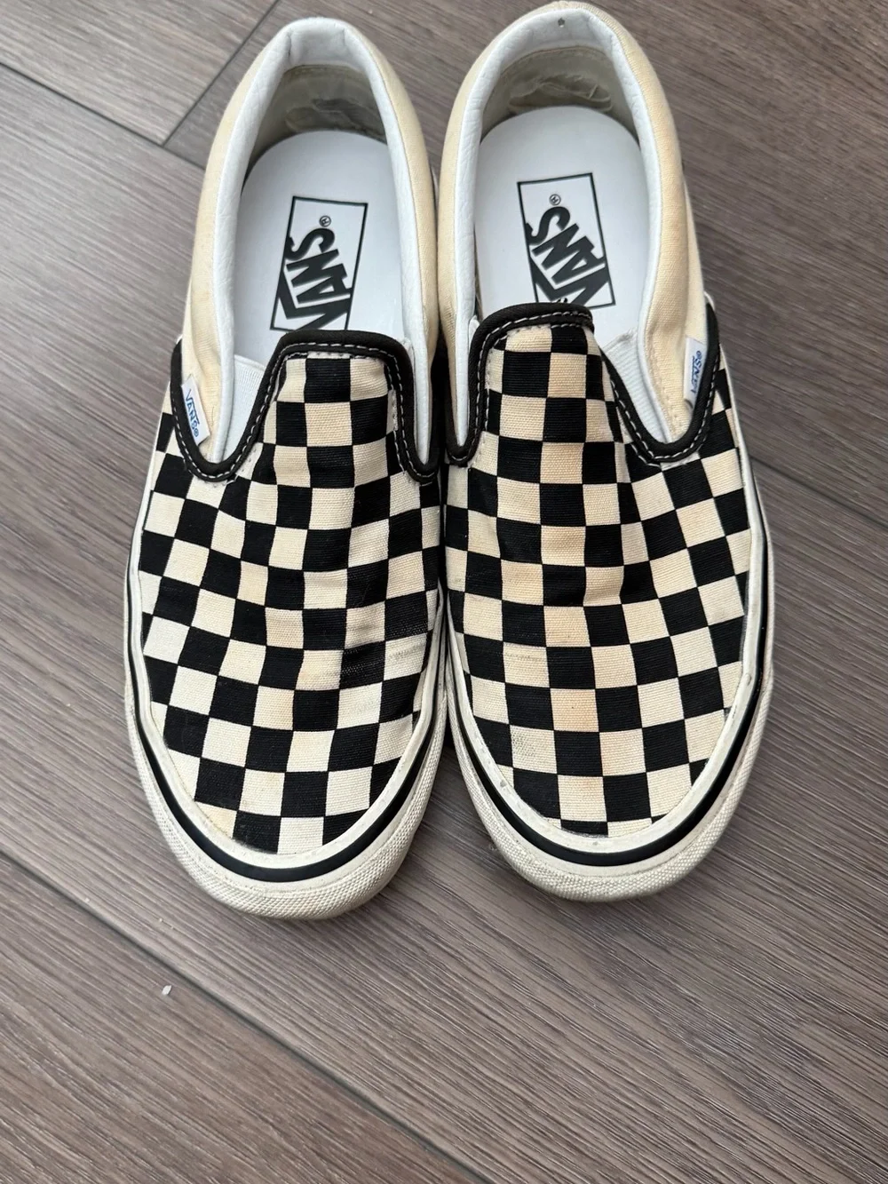 Vans Checkerboard Slip-On Sneakers in Black and Cream